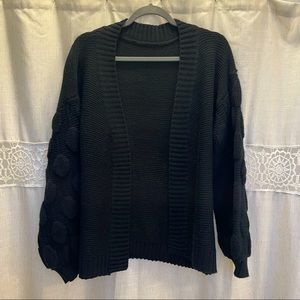 Black knit cardigan.